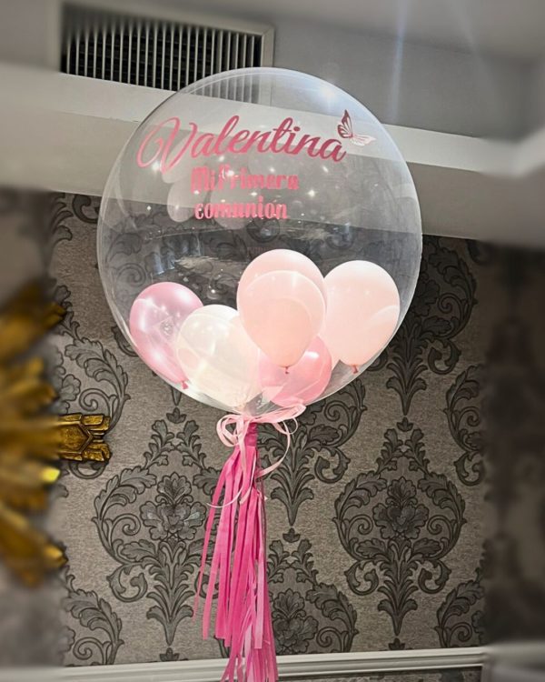 Globo burbuja con helio relleno de globos rosados